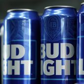 Cans of Bud Light beer are seen before a baseball game between the Philadelphia Phillies and the Seattle Mariners on April 25, 2023, in Philadelphia. Anheuser-Busch InBev has reported a drop in U.S. revenue in the second quarter as Bud Light sales plunged amid conservative backlash over a campaign with transgender influencer Dylan Mulvaney. (AP Photo/Matt Slocum) **FILE**