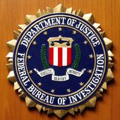 Logo of the Federal Bureau of Investigation of the Department of Justice of the United States of America pictured at the embassy of the USA in Berlin, Germany, Friday, Aug. 10, 2007. (AP Photo/Michael Sohn)