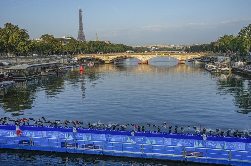 Triathletes swim in the Seine ahead of Paris Olympics