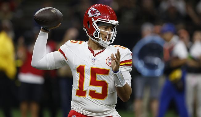 Kansas City Chiefs quarterback Patrick Mahomes (15) sets back to pass in the first half of a preseason NFL football game against the New Orleans Saints in New Orleans, Sunday, Aug. 13, 2023. (AP Photo/Butch Dill)