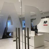 FILE - The Associated Press logo is shown at the entrance to the news organization&#x27;s office in New York on Thursday, July 13, 2023. The Associated Press has issued guidelines for its journalists on use of artificial intelligence, saying the tool cannot be used to create publishable content and images for the news service. (AP Photo/Aaron Jackson, File